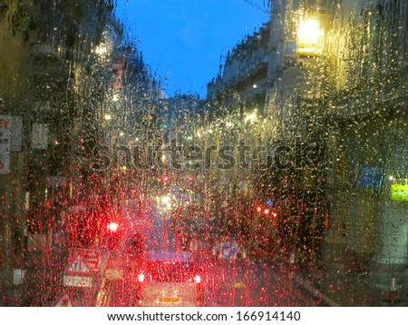 City lights from London bus in rainy night