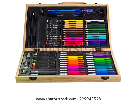 Stationary, Colored pencils and pastels in plywood box isolated on white background