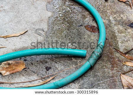 Leaking green water hose, not good for water saving