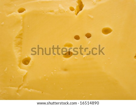 The big piece of cheese. A background. Macro