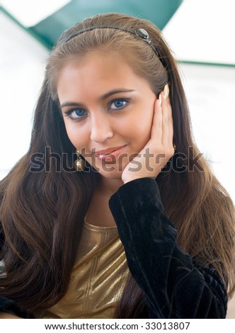 Portrait of the young serenity girl in cafe