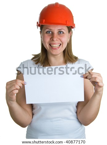 The young smiling women in a red building helmet holding a sheet of paper in a hand. Isolation on a white background