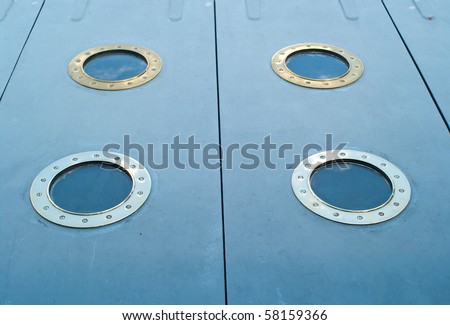 The ship metal windows on grey background