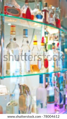 Abstract bottles of spirits and liquor at the bar. Blurring photo