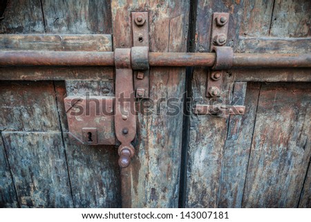 Rusty lock of old gates of Buonconsiglio castle in Trento, Trentino, Italy- details of the internal gate.