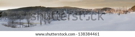 Panaromic sunrise over Stowe Community Church on a cold winter morning, Stowe, Vermont, USA