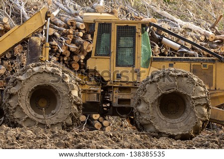 Mud covered heavy duty logging tractor, Stowe, Vermont, USA