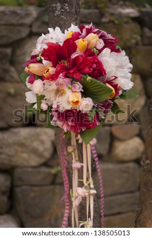 Colorful floral bouquet on a tree.