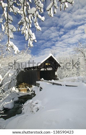 A snow blanketed Emily's covered bridge in Stowe Vermont, USA