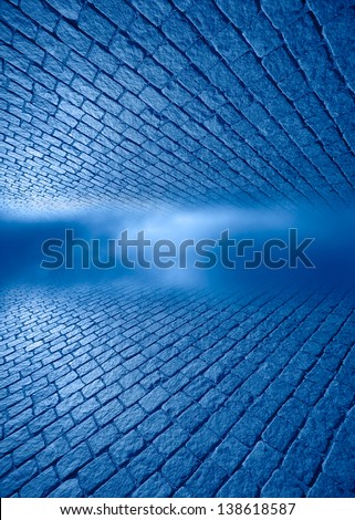 Blue space between a brick floor and ceiling.