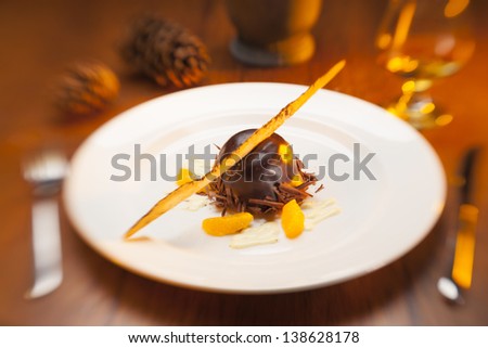 Fancy restaurant chocolate dinner dessert on a white plate.