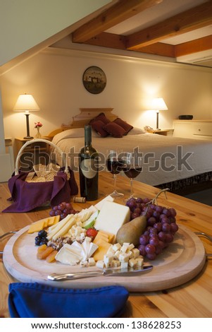 Wine, cheese and grapes for a snack in a upscale hotel room, Stowe, Vermont, USA