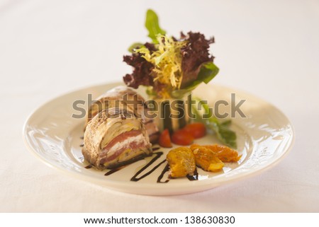 Gourmet sandwich on a white plate.