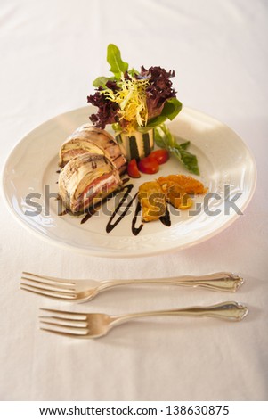 Gourmet sandwich on a white plate.