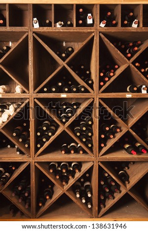 A rack of wine bottles in a wine cellar.