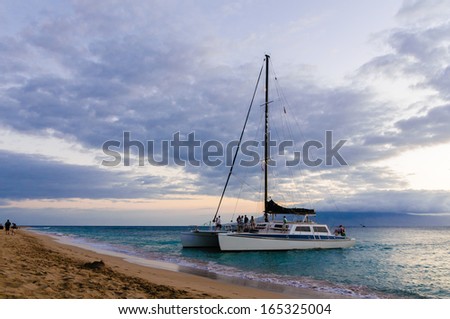 Catamaran cruise boat at sunset on Maui, Hawaii, USA