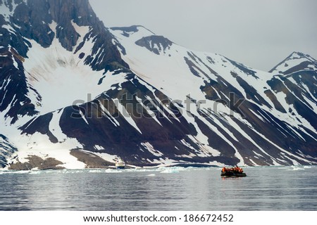 Tourists in inflatable ocean rafts in the Arctic Ocean, Hornsund, Norway