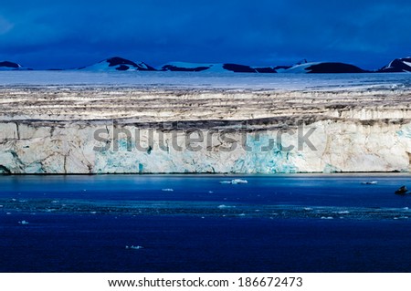 The end of a glacier in the Arctic Circle where it falls into the Arctic Ocean in Hornsund, Svalbard, Norway.
