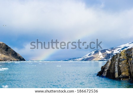 Rainbow over the Arctic Ocean in Hornsund, Svalbard, Norwasy.