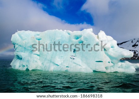 Green iceberg floating in the Arctic Ocean, Hornsund, Norway