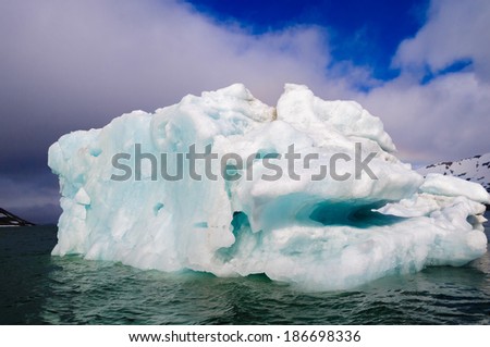 Green iceberg floating in the Arctic Ocean, Hornsund, Norway