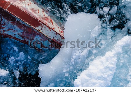 Bow of ice breaker going through ice in the Arctic Circle.