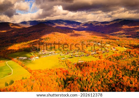 Aerial view of Trapp Family Lodge during peak foliage season with Mt. Mansfiled in the background, Stowe, Vermont, USA