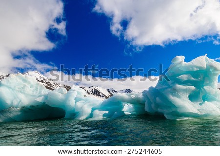 Close up of blue green icebergs floating in a fjord in Hornsund, Svalbard, Norway.