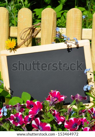 sign with flowers on fence free