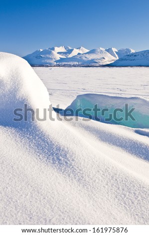 view over the frozen lake akkajaure to the akka massif, stora sjoefallet national park, lapland, sweden