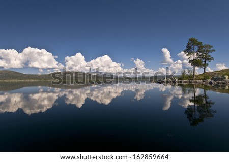 Mirrowing clouds in lake rogen, nature reserve, sweden