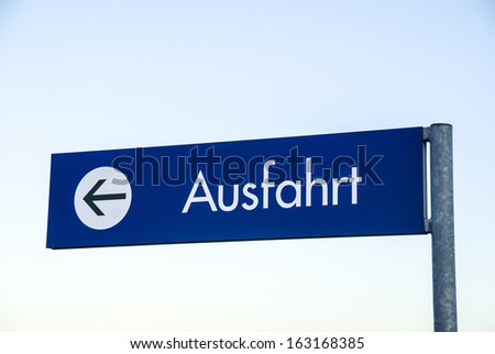 Exit sign with arrow, german word ausfahrt, translation: exit