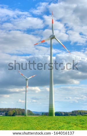 Wind power station under dramatic sky