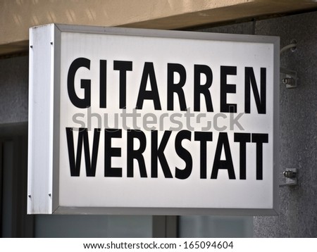 German advertising Sign, translation: Guitar studio