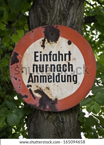 Old German private road sign, translation: Entrance only with application