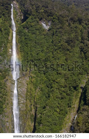 Humboldt Falls, waters of Humboldt Falls drop 275 m down a steep cliff. Hollyford Valley, Fjordland National Park, South Island, New Zealand