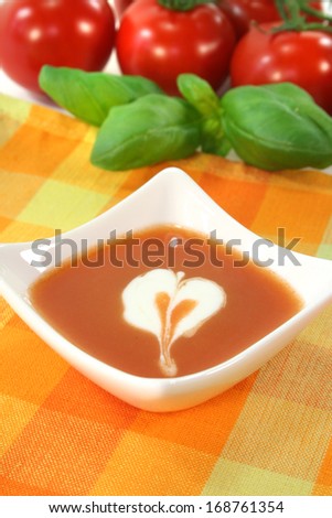 tomato soup with dollop of cream
