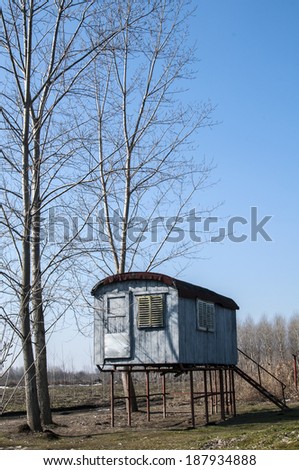 Stilt fisherman bungalow on iron piles in sunny winter