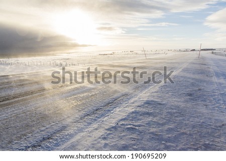 Drifting snow on a road in Norway, near Kiberg