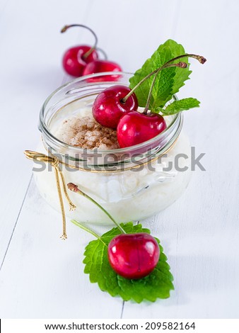 Rice pudding with sugar and cinnamon and cherries