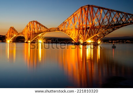 The Forth Rail bridge illuminated at dawn, Edinburgh, Scotland