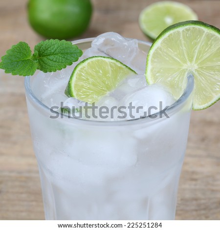 mineral water in a glass and limes