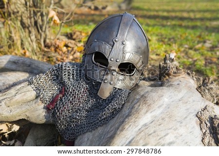 Old forged Viking helmet on a leaf.