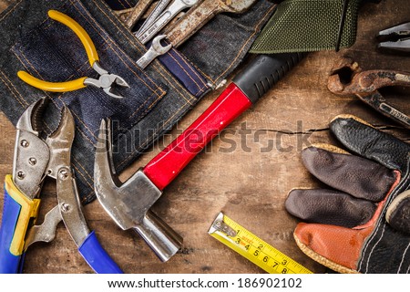 tool renovation on grunge wood background