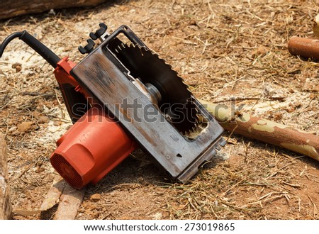 electric saw on ground for woodwork