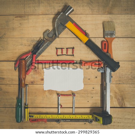 paper card and tool on wood with vintage style