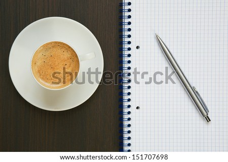 Coffee, pen and notebook.