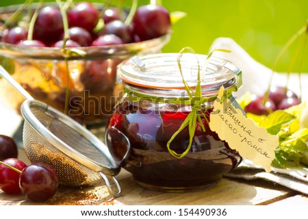 Hand-made cherry confiture with balsamic vinegar and hand written labels