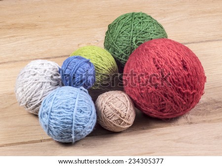 Image of wool balls wood background close up