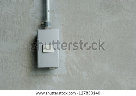 light switches on cement wall